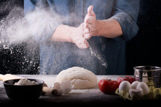 tagAlt.Baker prepares the dough on table