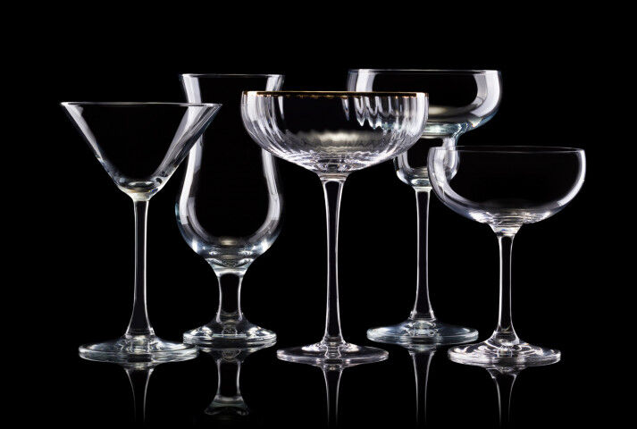 Set of different empty glasses for drinks on black background_2020101010